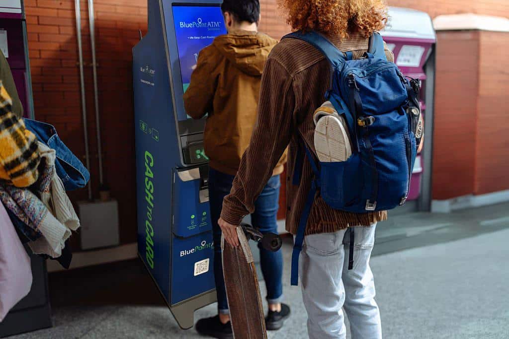 Students using a BluePoint Reverse ATM at school